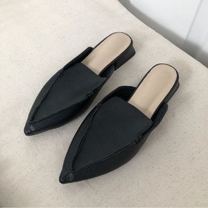 Black pointed loafers